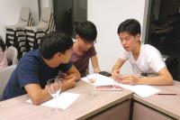 Students doing a group sharing as a warm-up exercise of public speaking
